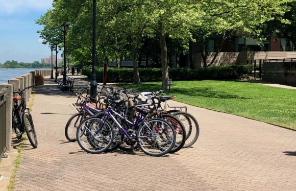 Hey, RIOC! Let's do something about the bikes while there's time. Just finding a place to park bikes already narrows the promenade, blocking some areas from use by baby strollers and wheelchairs. And that's before you factor in riders.